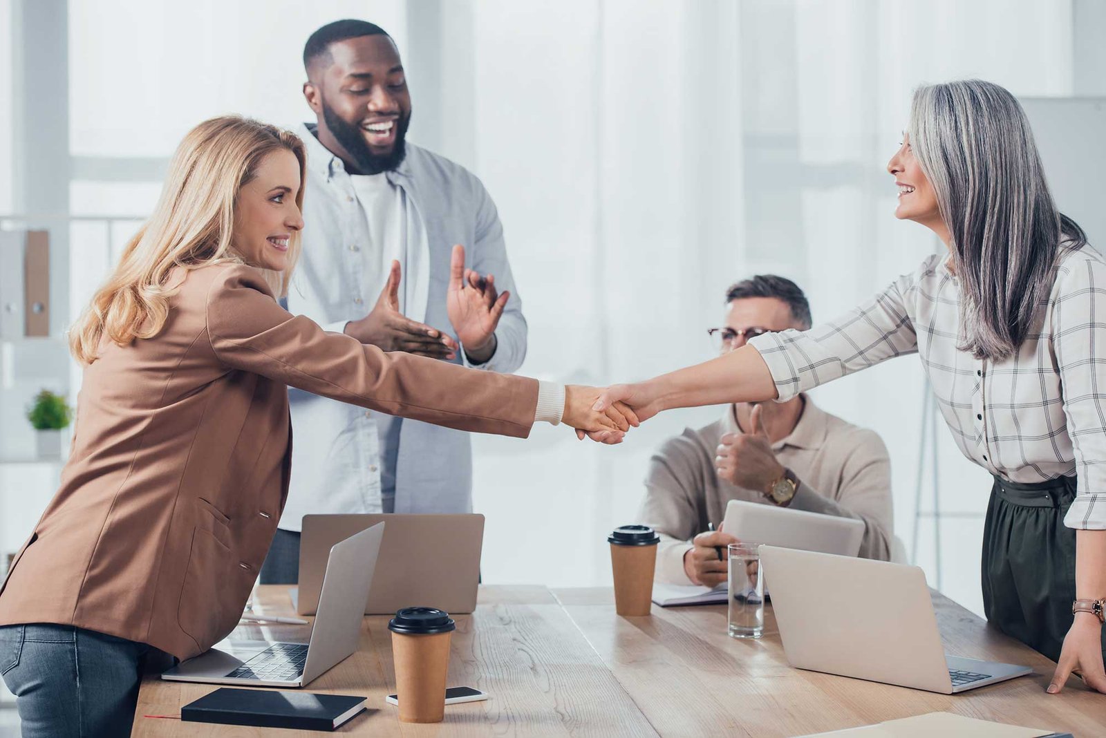 Smiling Multicultural Colleagues Shaking Hands Dur 2022 12 16 19 22 49 Utc